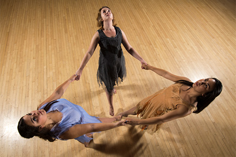 A view of 3 dancers from above.