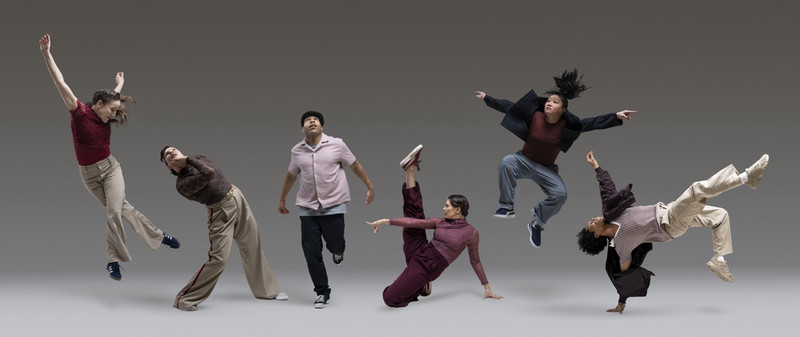 Multiple people break dancing.