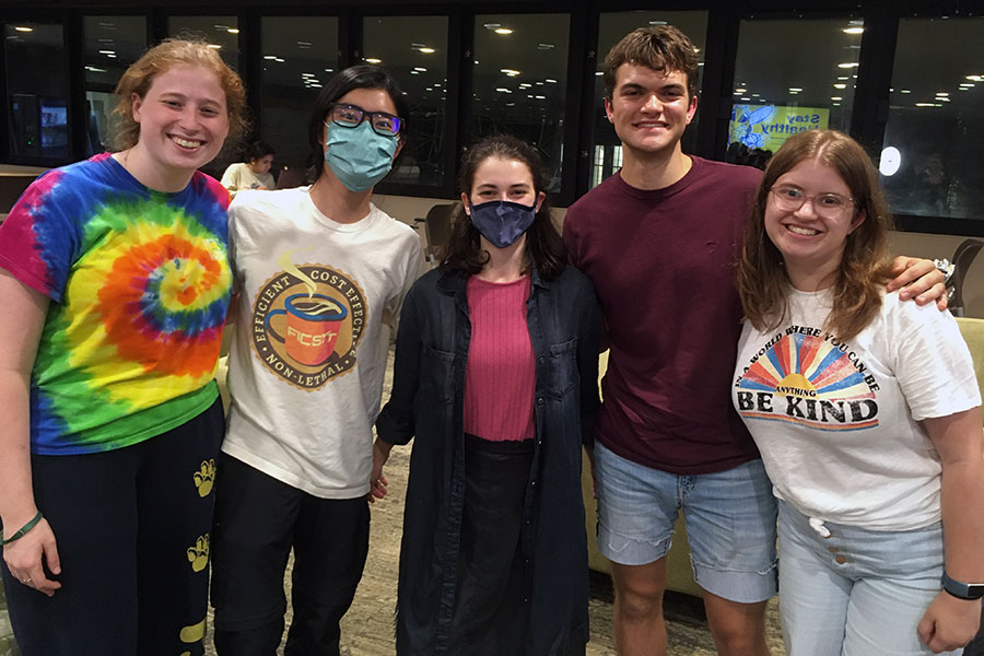 Five students wearing masks.
