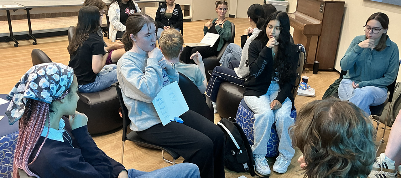A group of students sitting in a lounge.
