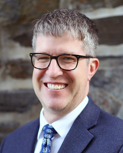 Headshot of Dean Sam Thomas.