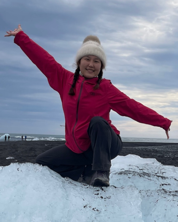 sara sitting on a block of ice