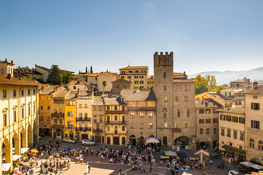 An aerial view of a plaza and buildings in Arezzo.