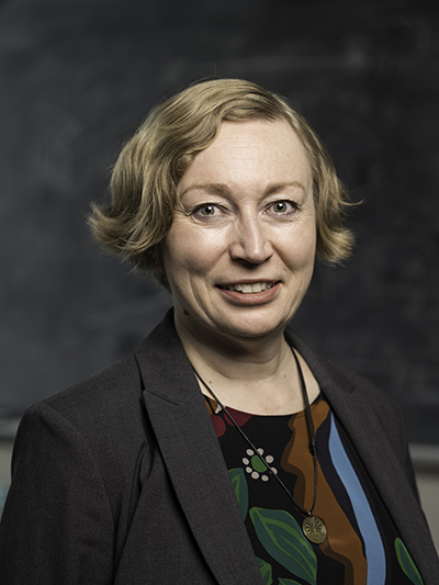 Headshot of Professor Demina.